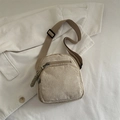 Beige corduroy crossbody bag with adjustable strap and textured striped surface - Khaki