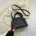 Chic black quilted dome bag with top handles and detachable shoulder strap in vegan leather - Black