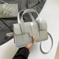 Elegante zilveren handtas met glitterflap en gouden draaisluiting voor dames - Zilver