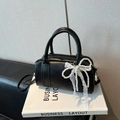 Classic black Boston handbag with elegant white lace and pearl bow charm on a display box - With Pendant / Black