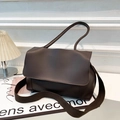 Deep brown leather tote bag with wide shoulder strap in a minimalist stylish design - Brown