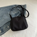 Minimalist black crossbody bag in crescent shape with adjustable fabric shoulder strap - Black