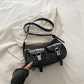 Minimalist black crescent crossbody bag with double buckle pockets and silver studs - Black