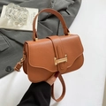 Caramel lychee leather flap handbag with gold metal clasp and crossbody strap - Brown