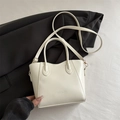 Minimalist white leather bucket handbag with gold hardware and fashion embossing - White