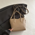 Khaki synthetic leather bucket bag with FASHION text and gold-tone hardware detail - Khaki