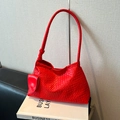 Vibrant red woven shoulder bag for women with matching mini charm and slim strap - Red