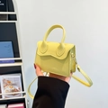 Bright yellow PU leather mini handbag with wavy edge flap and crossbody strap - Yellow