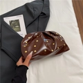 Dark brown pleated cloud bag with gold studs and glossy finish in a chic handheld style - Brown