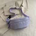 Purple corduroy waist bag with adjustable strap and woven zipper pull shown on clothing - Purple