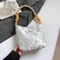 Blue satin underarm bag with butterfly embroidery and artistic wood bead handle decoration - Bow Blue