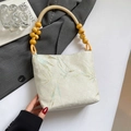 Embroidered bamboo leaf tote bag with wooden bead handle and beige fabric finish - Leaf Style Beige