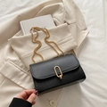 Minimalist black leather square crossbody bag with gold oval buckle and bead chain - Black