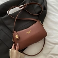 Brown litchi grain leather crossbody bag with gold fashion text and hardware details - Brown