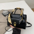 Elegante borsa a mano in pelle nera con manico in sciarpa di seta e chiusura dorata - Nero