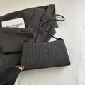Minimalist black woven underarm bag with sleek leather straps for a modern fashion look - Black (Without Charm)