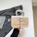 Chic beige crossbody bag with V-shaped woven texture and metallic silver handle - Off-white