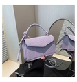 Detail of the lavender woven crossbody bag showing intricate cross-knit texture and rope handles - Purple