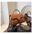 Detail of warm brown tote bag with chocolate square quilted pattern and glossy PU texture - Brown