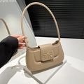 Minimalistische beige PU-Schultertasche mit goldener Schleifenschließe auf Buch-Deko - Khaki