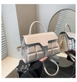 Detail of beige handbag featuring 3D geometric chocolate embossed pattern and smooth flap - Khaki