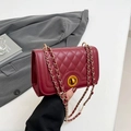 Quilted burgundy chain shoulder bag with elegant gold-tone rotary lock and strap - Red