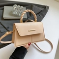 Chic beige square handbag with woven chain handle and adjustable crossbody strap - Khaki