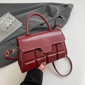 Chic burgundy crossbody handbag with chocolate embossed texture and gold hardware - Red