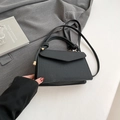 Solid black woven texture crossbody bag with gold hardware and knotted handle design - Black