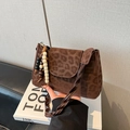 Brown leopard print crossbody bag with woven strap and beaded tassel detail - With Pendant / Coffee Leopard