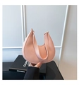 Detailed macro view of pink litchi grain leather texture on minimalist crescent bag - Pink