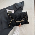 Elegant black snake-pattern envelope clutch bag with gold metallic trim and magnetic closure - Black
