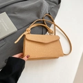 Chic beige woven crossbody bag with knot handle and envelope flap closure - Tan