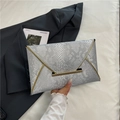 Silver snakeskin clutch bag with gold metallic trim and envelope closure for evening - Silver