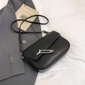 Minimalist black leather underarm bag with modern silver geometric metal buckle - Black