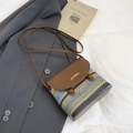Rainbow woven crossbody bag with brown leather flap and colorful striped texture - Brown