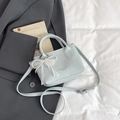 Light blue bucket bag in lychee texture leather with pearl lace pendant and strap - Blue with Pendant