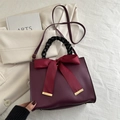 Elegant burgundy bridal handbag with large silk bow and black woven handle for weddings - Burgundy