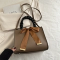 Vintage brown leather crossbody bag with black woven handle and large satin bow detail - Brown