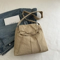 Khaki nylon crossbody bag with drawstring bow and adjustable strap in minimalist style - Khaki