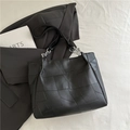 Minimalist black tote bag with geometric patchwork and stylish silver chain detail - Black without Pendant