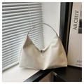 Detailed view of white minimalist hobo bag with smooth matte leather and zipper closure - White