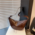 Brown semi-circle hobo bag in glossy patent leather finish with adjustable silver buckle - Brown