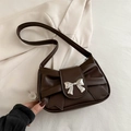 Dark brown retro shoulder bag with metallic bow detail and stylish pleated texture - Brown