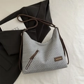 Gray and white herringbone woven crescent bag with brown leather accents and strap - Gray