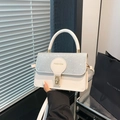 Elegant white crossbody bag with sparkling rhinestone flap and golden twist lock - Silver