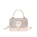 White crossbody bag with silver sequins and gold hardware in a chic fashion style - White