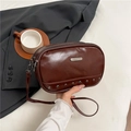 Brown glossy PU leather crossbody bag with silver rivets and metal brand plate - Brown
