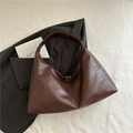 Minimalist dark brown hobo shoulder bag with textured faux leather and wide strap - Brown