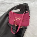 Chic pink underarm shoulder bag with golden bow and premium leather texture - Rose Pink